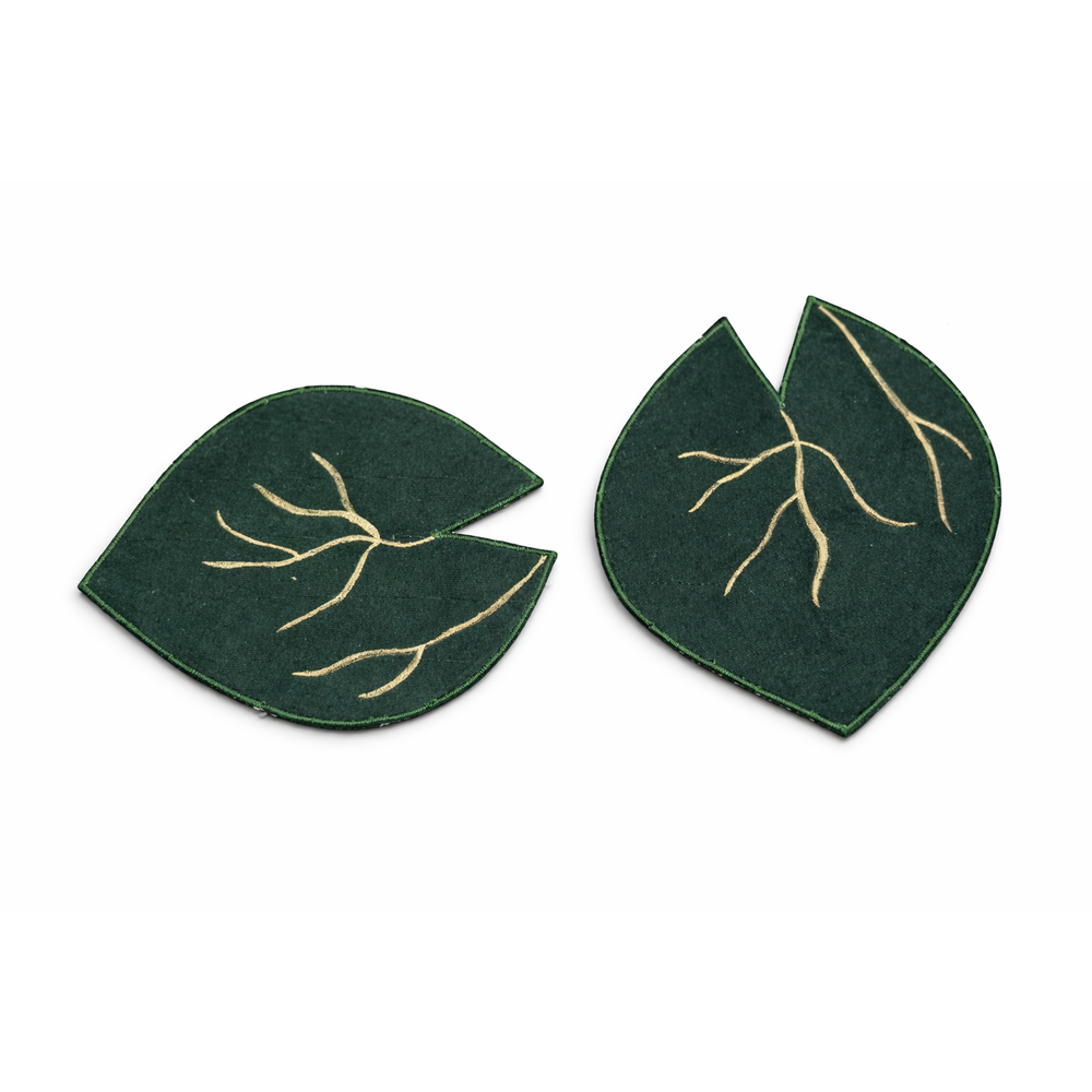 Pair of green leaf-shaped fabric coasters with gold detailing