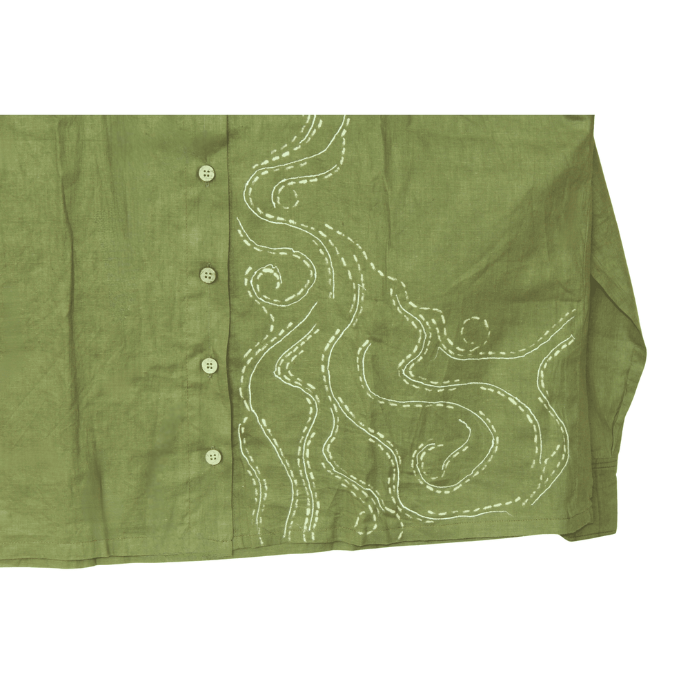 Green shirt with white embroidery on a white background