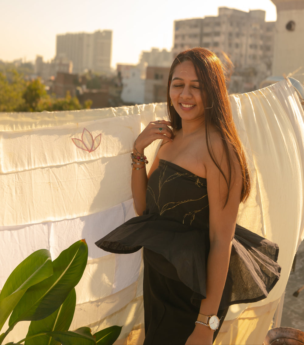 Woman wearing an elegant strapless evening Tube Top with subtle handcrafted detail, perfect party dress for women.