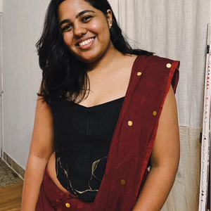 Black strapless corset blouse with gold detailing, styled as a saree blouse or party corset top for festive occasions.