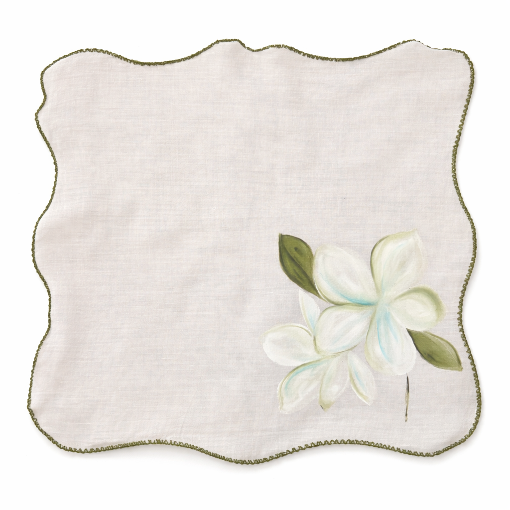 Cotton table napkins with colorful floral designs and scalloped edges, reusable dinner napkins designed for elegant dining table and home entertaining.