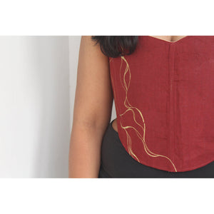 Red top with gold Painting on a plain background