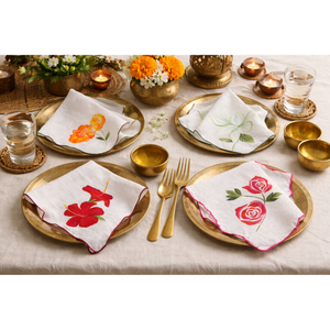 Reusable cotton dinner napkins with botanical floral illustrations and stitched scalloped borders, decorative napkins for dining table and home entertaining.