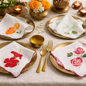 Reusable cotton dinner napkins with botanical floral illustrations and stitched scalloped borders, decorative napkins for dining table and home entertaining.
