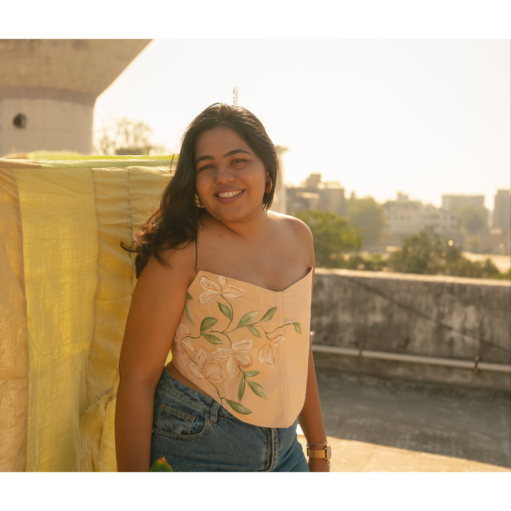 Peach corset top with floral Hand painted details and strapless neckline, inclusive corset blouse suitable for regular and plus size styling.