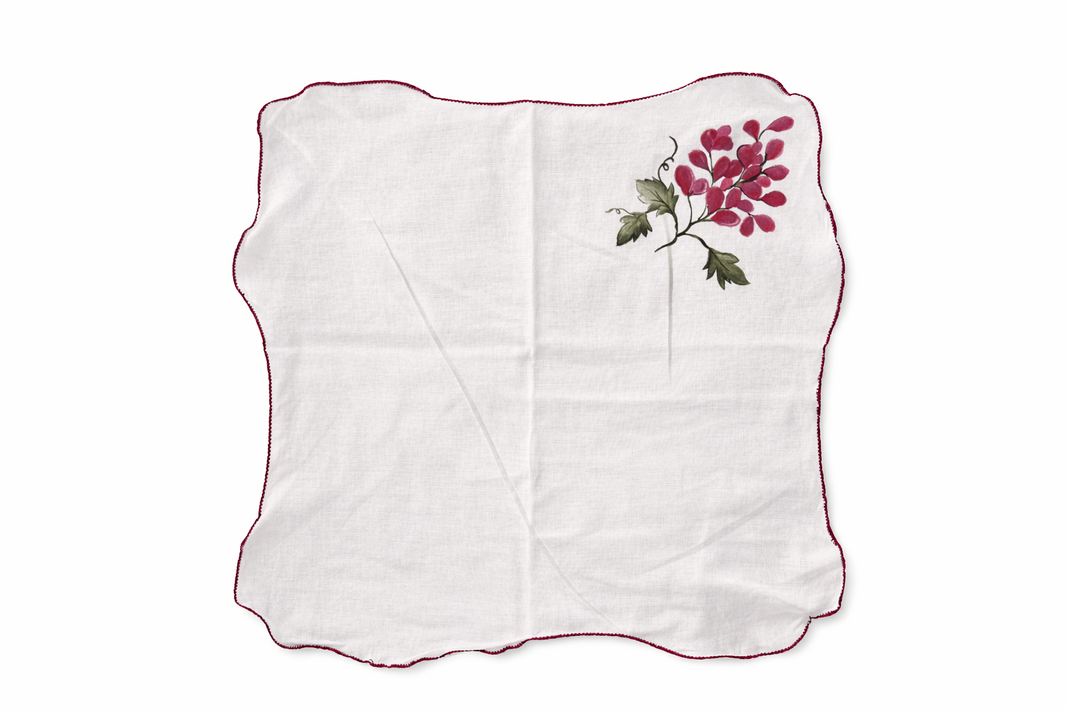 Reusable cotton cloth table napkins with fruit illustrations including lemon, orange, grapes and pomegranate, decorative napkins for dining table and brunch table settings.