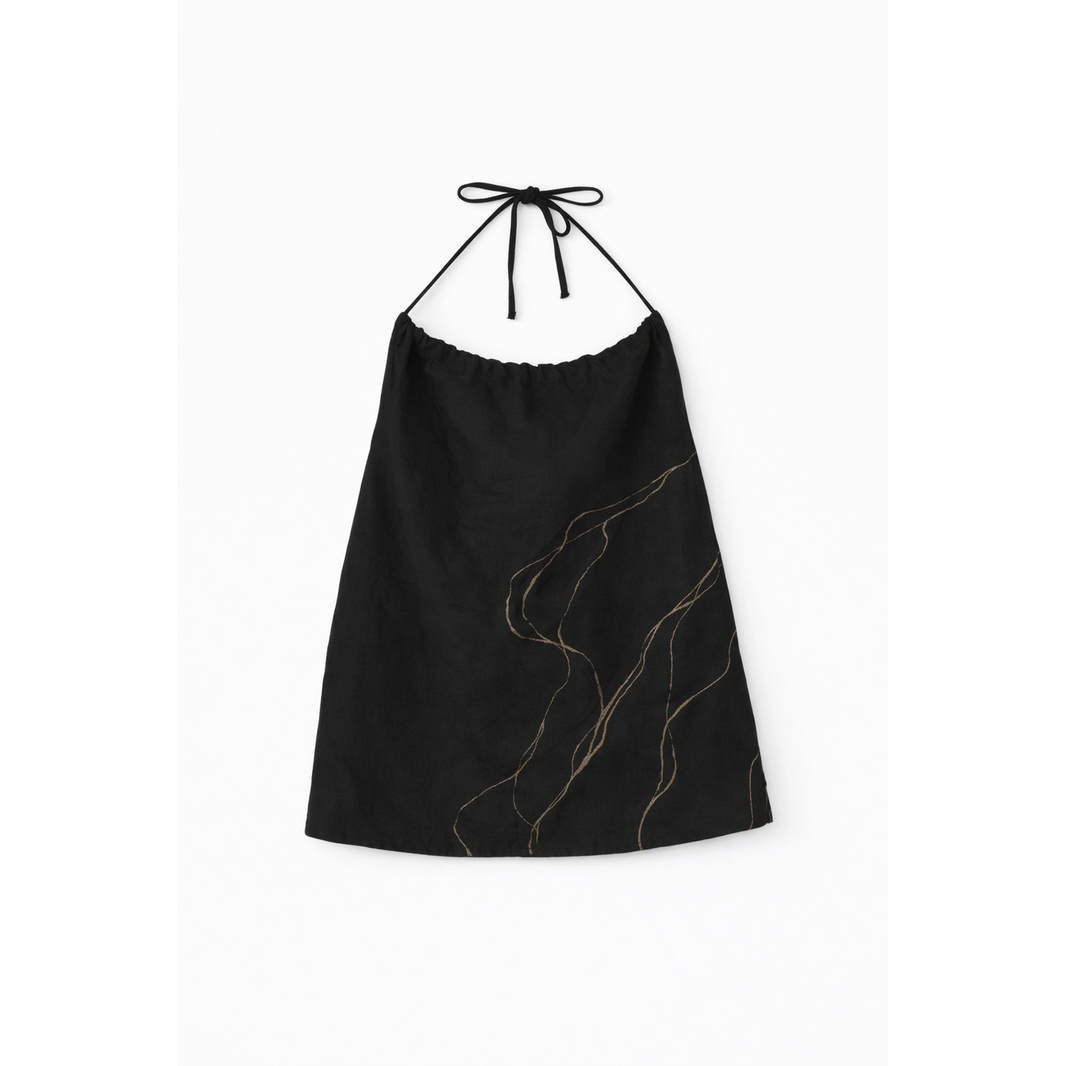 Black sleeveless strappy top with gold detailing, breathable cotton top styled with denim for casual summer outfits.