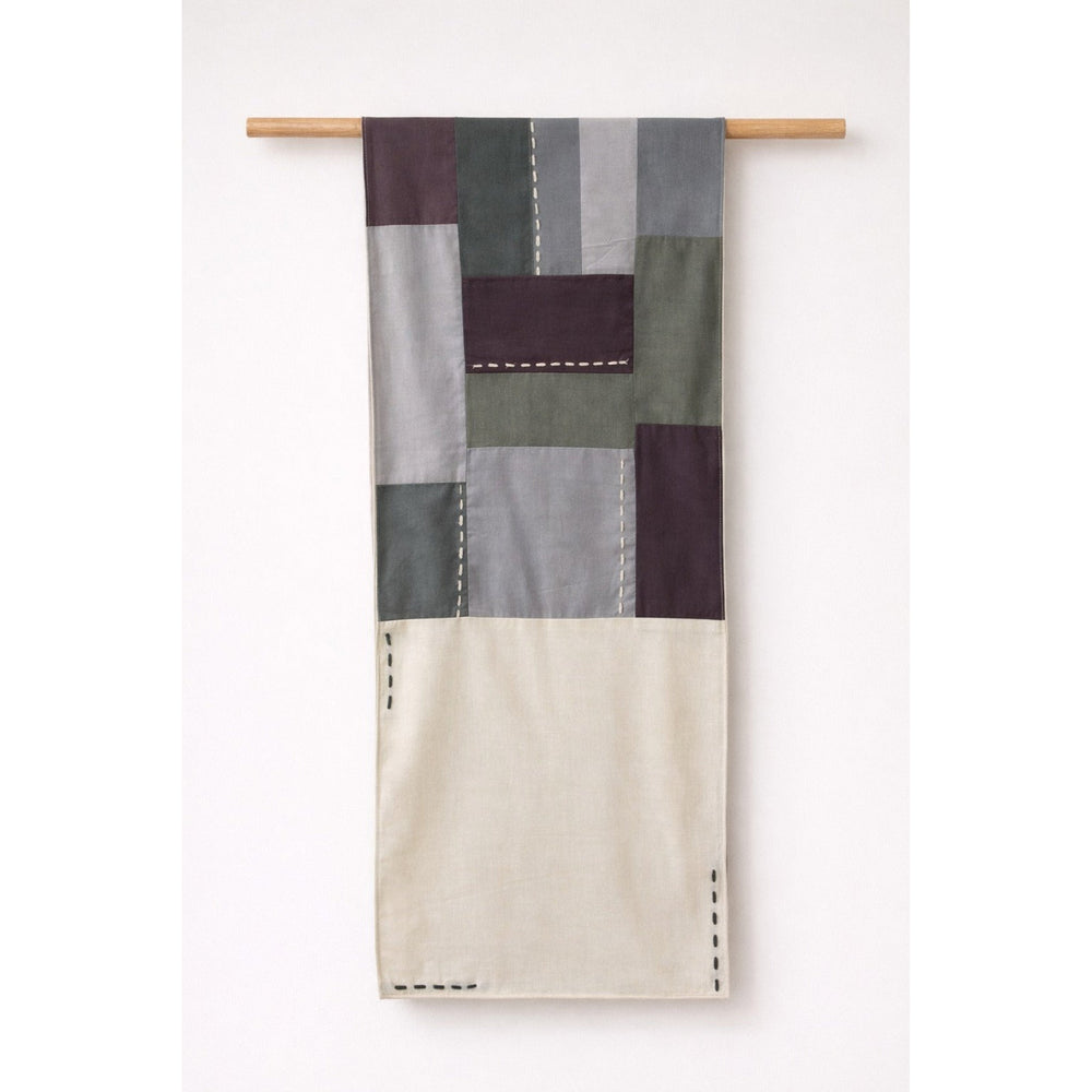 Handmade cotton patchwork table runner with neutral fabric panels and stitched detailing, table linen decor for dining tables and contemporary interiors.