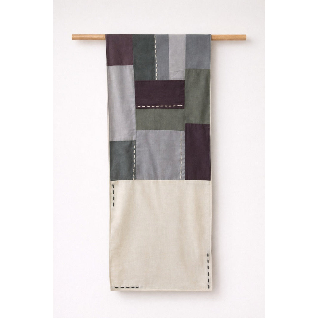 Handmade cotton patchwork table runner with neutral fabric panels and stitched detailing, table linen decor for dining tables and contemporary interiors.