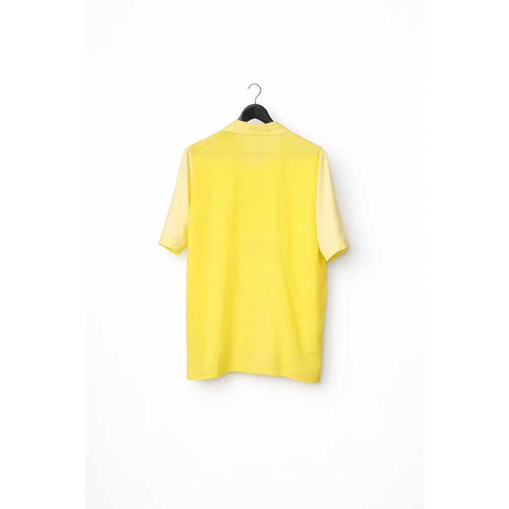 Back view of the yellow cotton Lime Shirt by JOD with hand-painted sun and wave motif