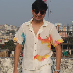 Relaxed fit men’s beach vacation shirt with hand painted colors, breathable summer shirt ideal for travel and holiday wear.