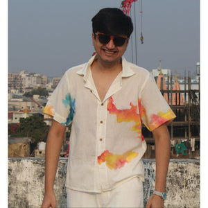 Relaxed fit men’s beach vacation shirt with hand painted colors, breathable summer shirt ideal for travel and holiday wear.