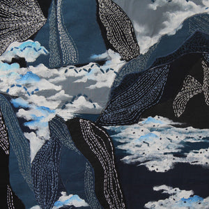 Kantha embroidery depicting mountains and cloud pattern on a dark background