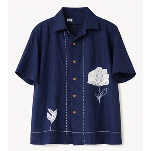 Navy blue shirt with white floral embroidery on a light gray background