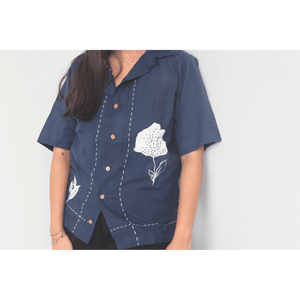 Navy blue relaxed fit shirt with white floral embroidery and patchwork