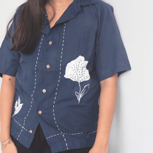 Navy blue relaxed fit shirt with white floral embroidery and patchwork