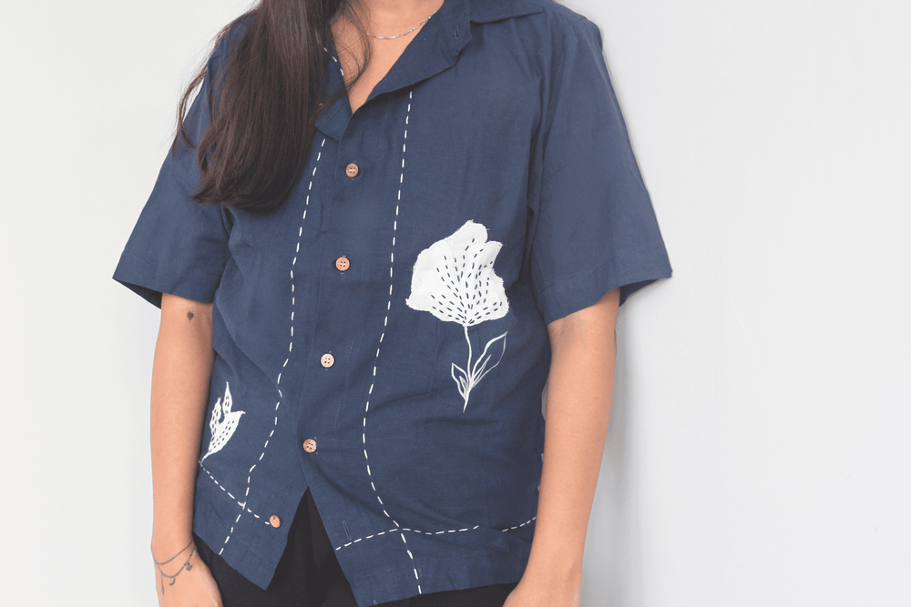 Navy blue relaxed fit shirt with white floral embroidery and patchwork