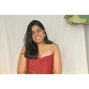 Strapless rust red corset top with gold detail design, stylish party corset blouse for festive occasions and saree looks.