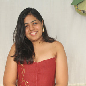 Strapless rust red corset top with gold detail design, stylish party corset blouse for festive occasions and saree looks.