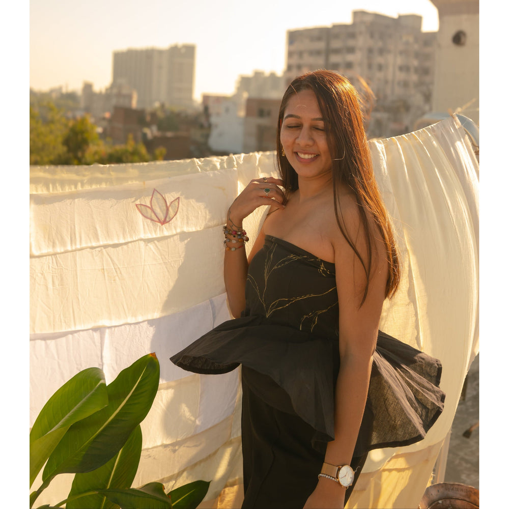 Woman wearing an elegant strapless evening Tube Top  with subtle handcrafted detail, perfect party dress for women.