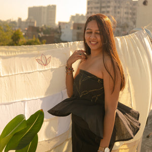 Woman wearing an elegant strapless evening Tube Top  with subtle handcrafted detail, perfect party dress for women.