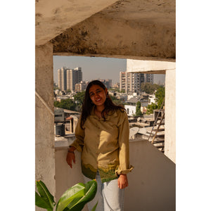 Woman wearing a relaxed fit pure cotton shirt for women, breathable casual shirt perfect for everyday styling and summer wear.