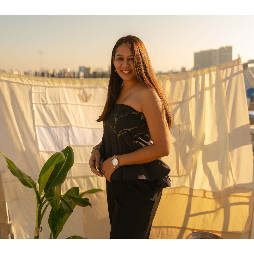 Woman wearing a strapless party wear dress with elegant detailing, stylish evening dress for women perfect for parties and special occasions.